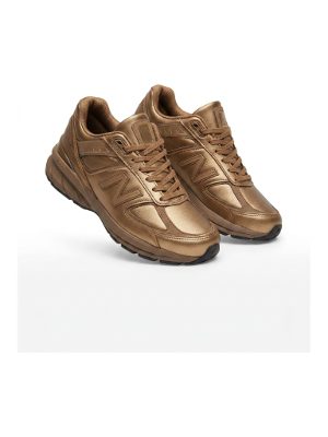 gold athletic sneakers